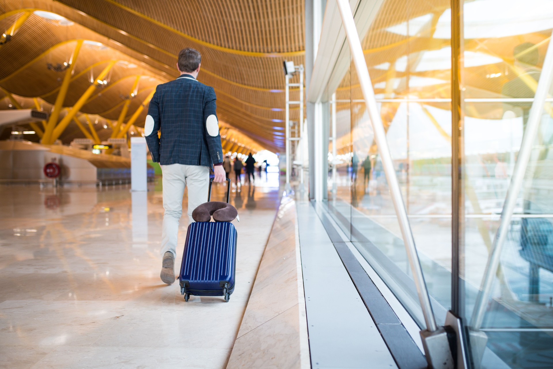 man back walking at the airport